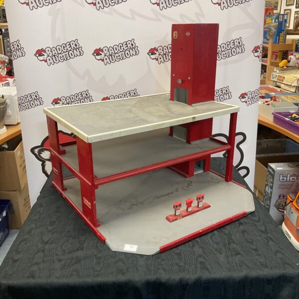 Front view of vintage wooden car garage with red and cream paint.