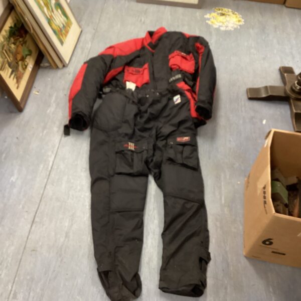 Weise Avenger motorcycle suit, black and red, showing wear.