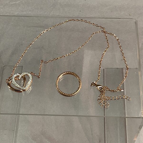 Silver gilt pendant necklace and white stone ring set.