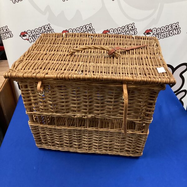 Vintage wicker pet basket for small animals, classic woven design.