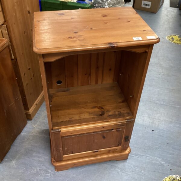 Vintage pine cabinet with a single door, rustic storage solution.