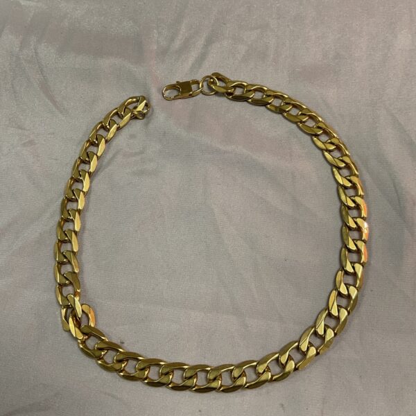 Close-up of a heavy 18ct gold plated chain necklace.
