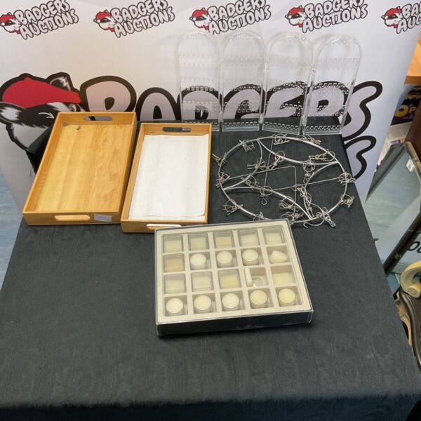 Vintage wooden display trays with multiple compartments for collectibles.