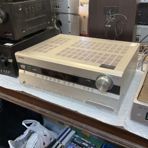 Silver Onkyo TX-SR605 AV receiver for home theater setup.