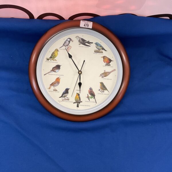 Colourful bird song quartz wall clock for home decor.