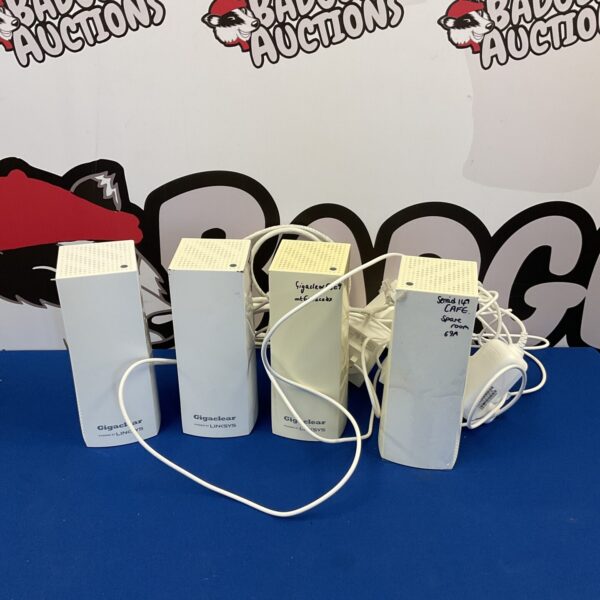 Lot of four Linksys Gigabit Clear internet boosters for wireless networking.