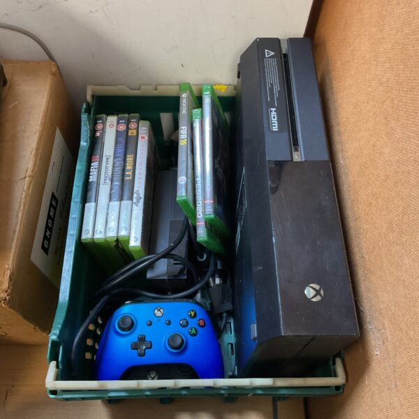 Microsoft Xbox One console with controller and games bundle.