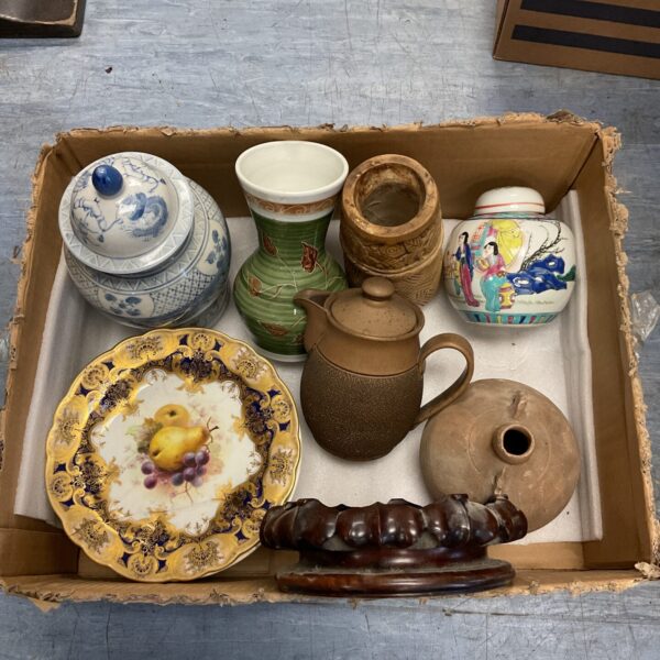 Overview of a pottery and china collection with a ginger jar.