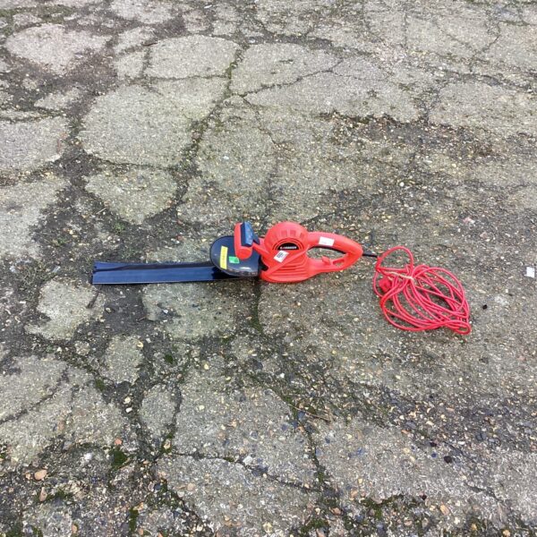 Sovereign electric hedge cutter for garden trimming and maintenance.