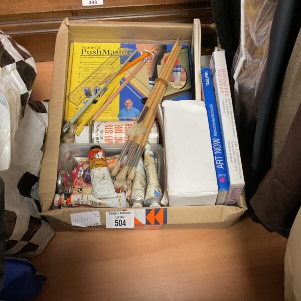 Mixed arts and crafts lot with paint brushes and supplies.