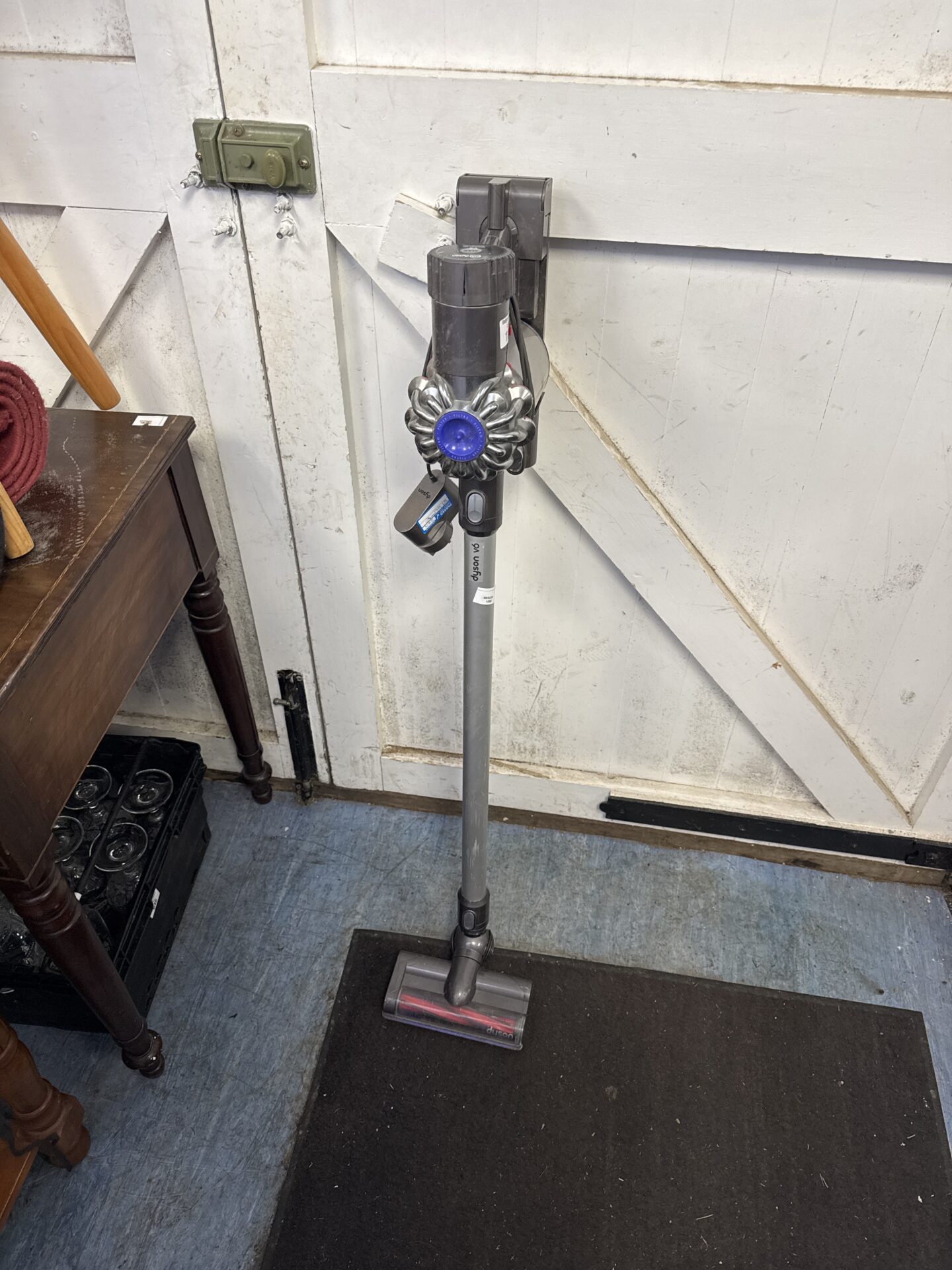1103 Dyson v6 cordless hoover with charger – untested, flat battery