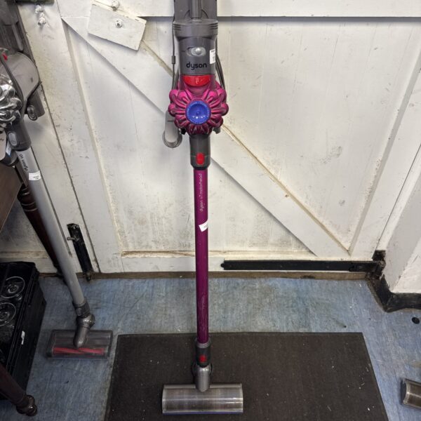 Dyson V7 Motörhead cordless vacuum cleaner in grey and purple.