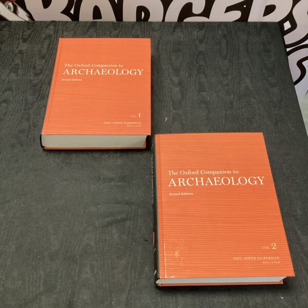 Two volumes of *The Oxford Companion to Archaeology* reference books.
