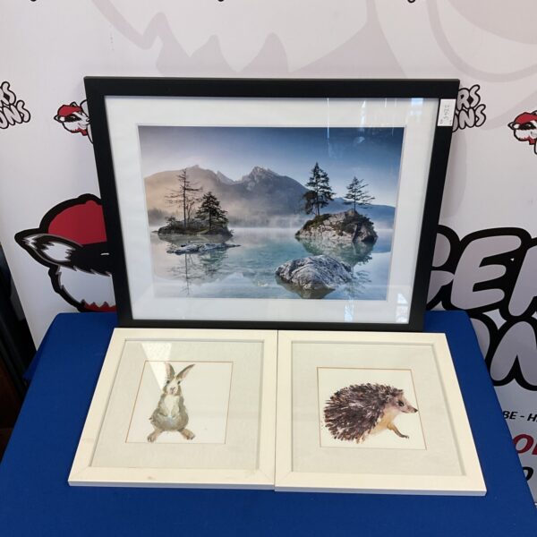 Vintage framed print of a serene lake scene.
