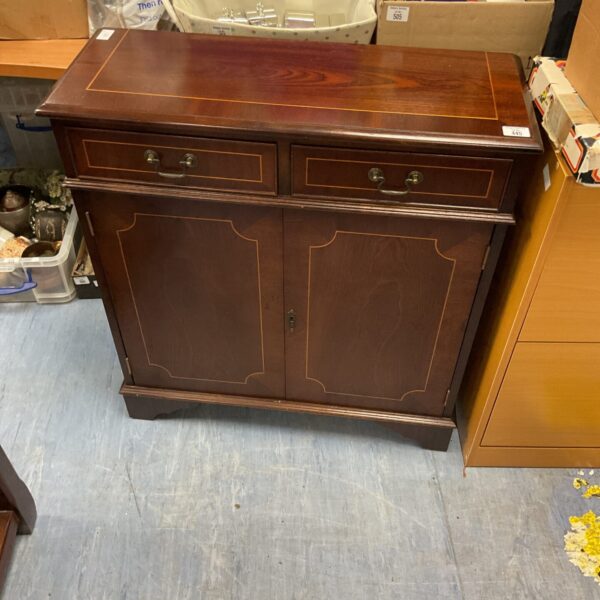 Front view of a reproduction mahogany two door side cabinet.