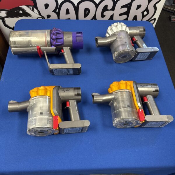Lot of four Dyson cordless hoover bodies for repair or parts.