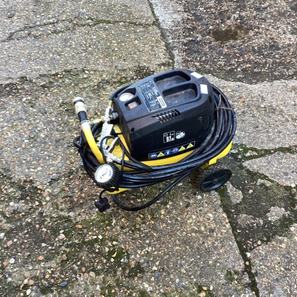Side view of a Stanley electric compressor with hose attached.