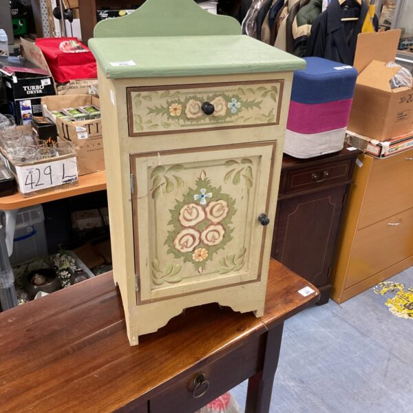 Shabby chic floral bedside cabinet with painted details.