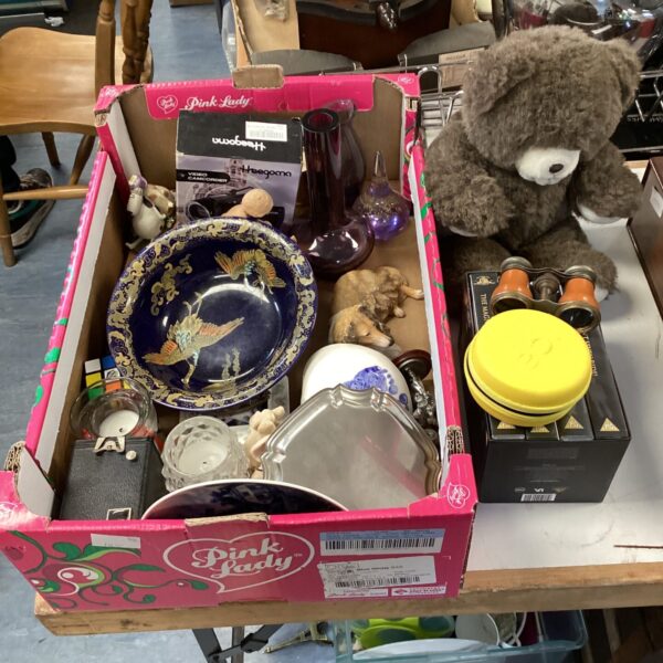 Mixed lot of vintage collectibles including camera, clock, and VHS tapes.