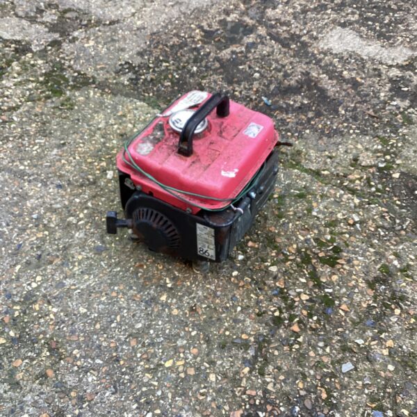 Red petrol generator for sale, portable power unit.