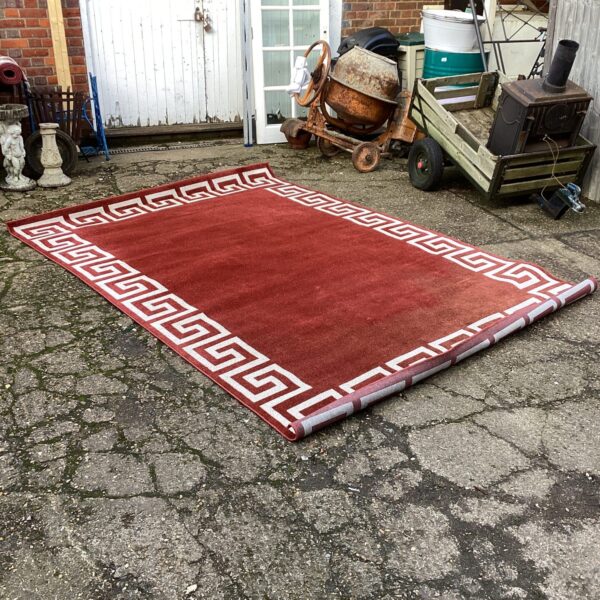 Vibrant 7x10 Greek Key rug displayed outdoors.