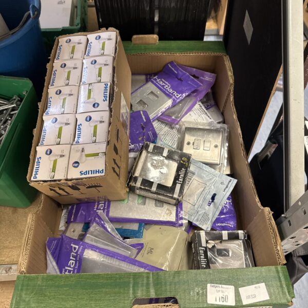 Assorted Philips electrical fittings and light bulbs in boxes.