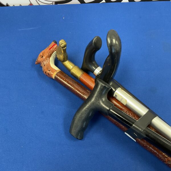 Antique walking sticks bundle featuring a brass horse head cane.