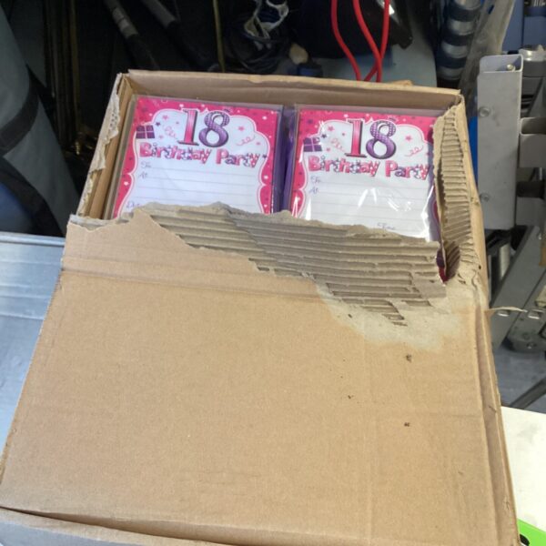 Box of 18th birthday invitation packs for party celebrations.