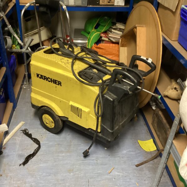 Side view of a used industrial Karcher cleaner.
