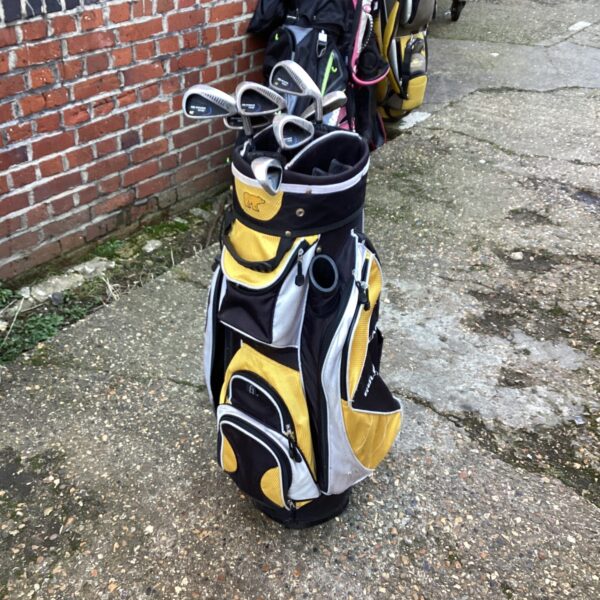 Vintage Golden Bear golf bag and clubs set for right-handed players.