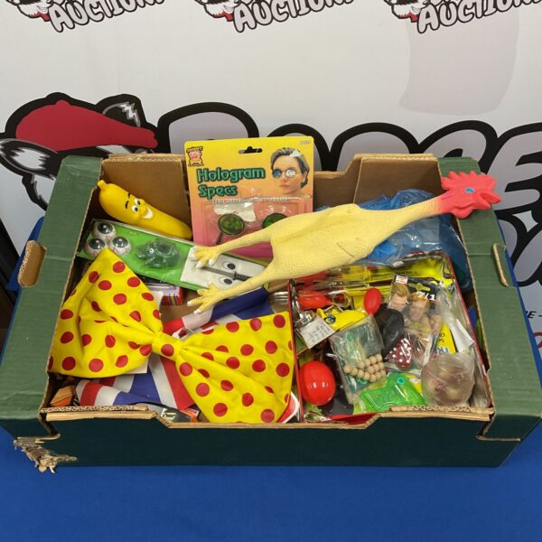 Assorted magic trick toys and joke items in a colourful lot.