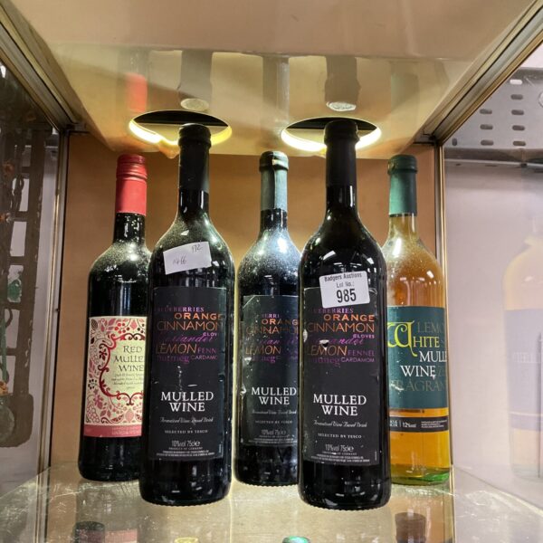 Collection of five bottles of festive mulled wine.