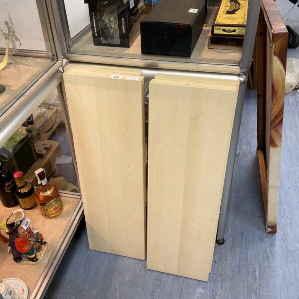 Four beech effect floating shelves for display and storage.