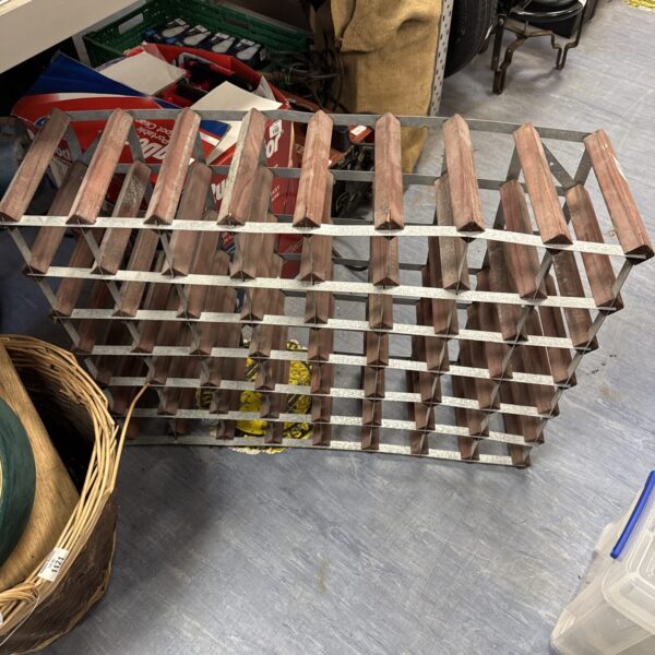 Vintage metal wine bottle rack needing repair and straightening.