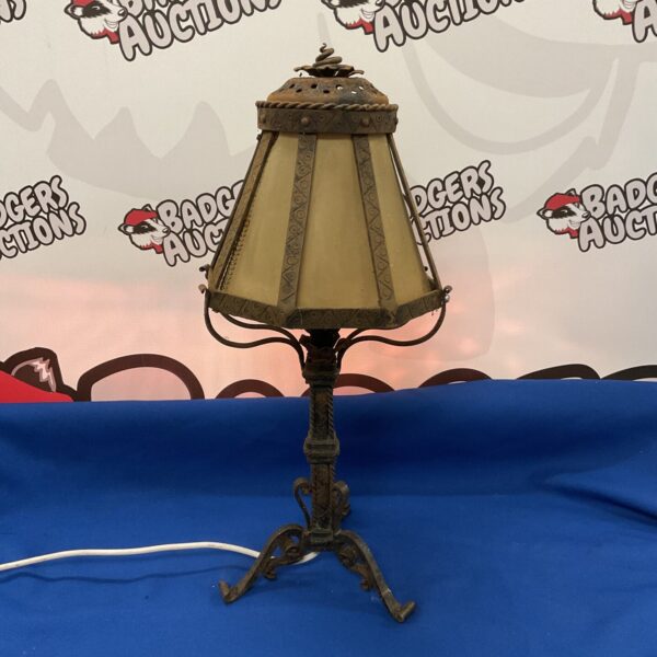 Antique Arts and Crafts wrought iron table lamp with textured glass shade.