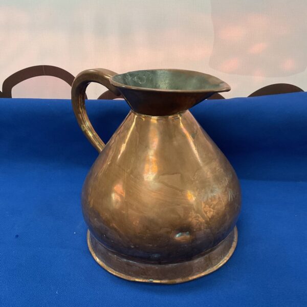 Vintage copper haystack jug with military markings.