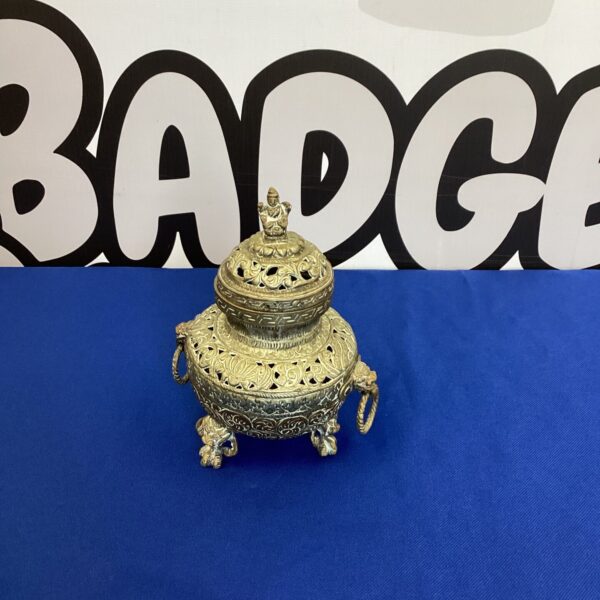 Ornate Indian brass incense burner with elephant feet.