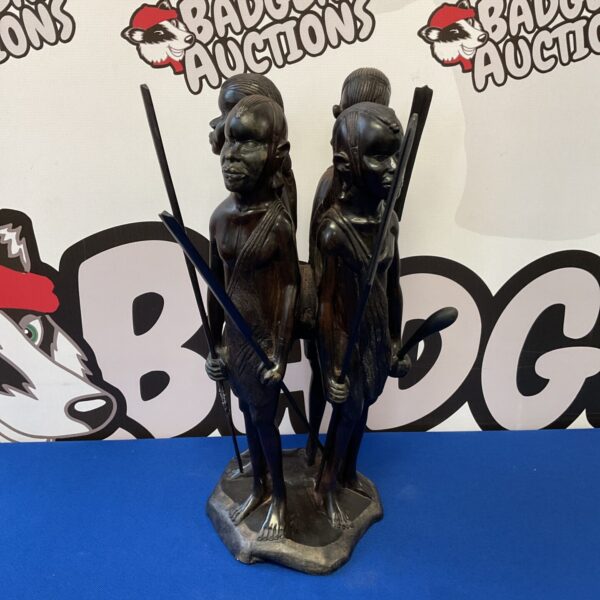 Detailed ironwood sculpture of a Maasai warrior fisherman signed P Mwambilo.