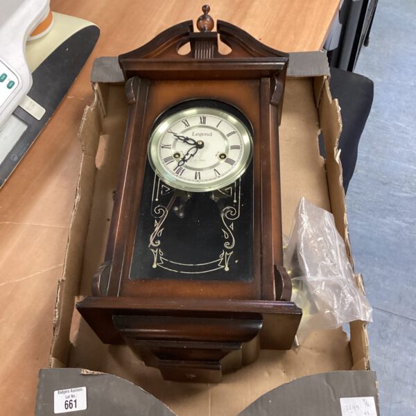 Vintage Legend wall clock with pendulum, ideal for home decor.