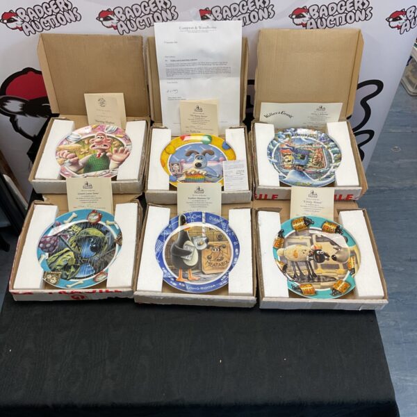 Wallace and Gromit collectible plates with certificates of authenticity.
