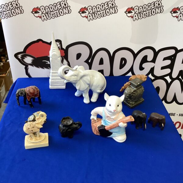 Vintage elephant figurine collection with Empire State Building.