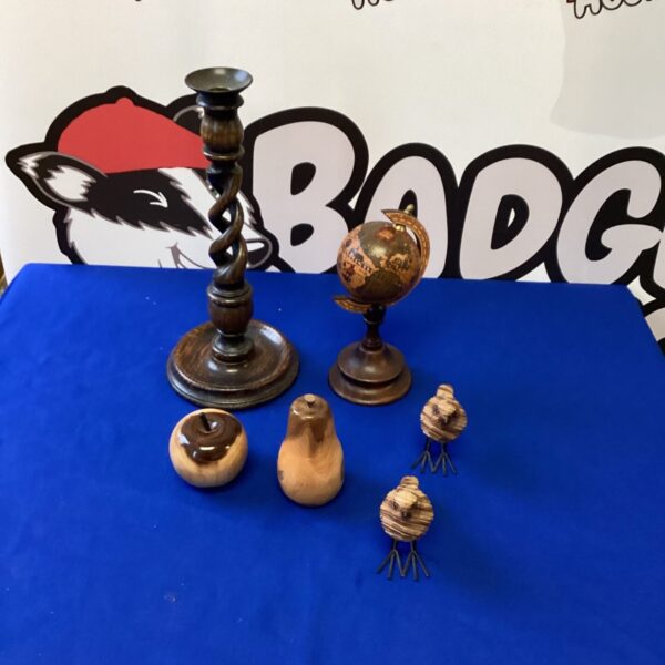 Vintage wooden collectibles including a candle holder and spheres.