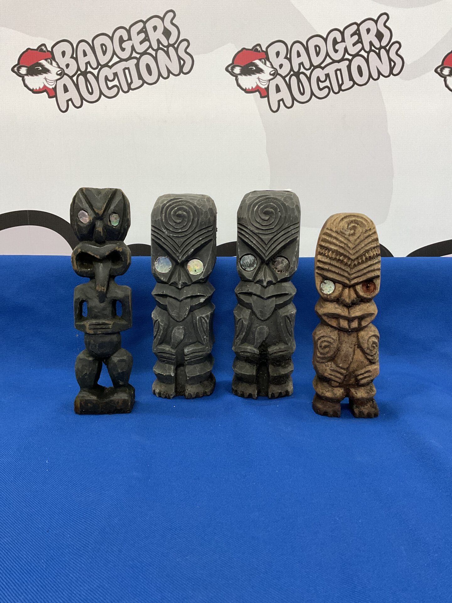 029 Set of four small carved wood & stone totem poles