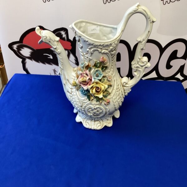Antique Capodimonte porcelain jug with vibrant floral hand-painted decoration.