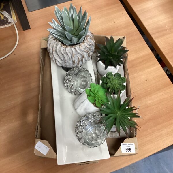 Mixed lot of artificial plants and decorative tealight holders for home decor.