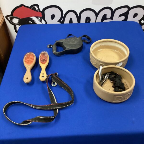 Vintage dog accessories lot including bowls, leads and brushes.