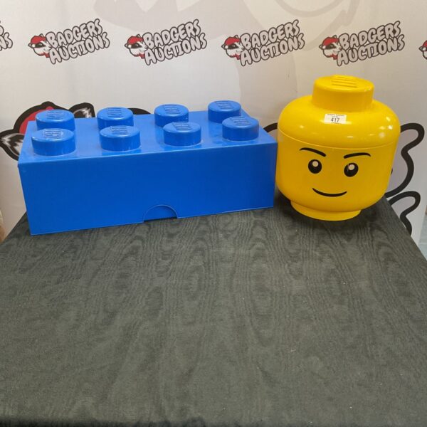 Empty Lego storage boxes with stud detailing.