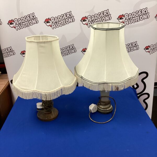 Vintage table lamp pair with carved wood and fabric shades.