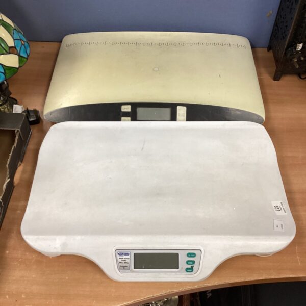Digital veterinary scale for weighing animals, showing signs of use.