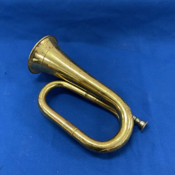 Vintage brass bugle horn, antique musical instrument, collectible item.